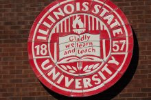 Image of the Illinois State University seal with the words Gladly we learn and teach.